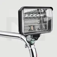 Rectangular work light on the chrome frame of the trowel