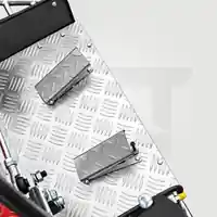 Throttle pedal and safety pedal on a chequer-plate platform