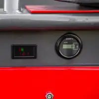 Digital display and QUARTZ hour meter on a grey panel above the red housing