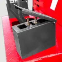 Grey box with a hinged lid on a red chequer-plate deck